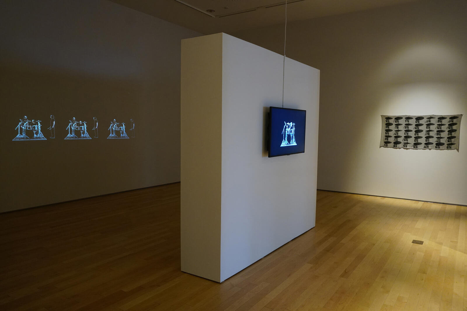 [ Fig. 16 ] <i>Cymbal Rhythm Pattern</i>, 2013. (Jacquard weaving. Cotton threads. 27 x 62 pc.) Exhibition views, Quai 5160. HD video, 4:45. (Video still.)